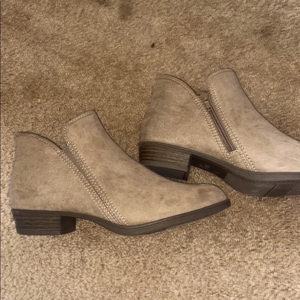 Woman’s light brown booties